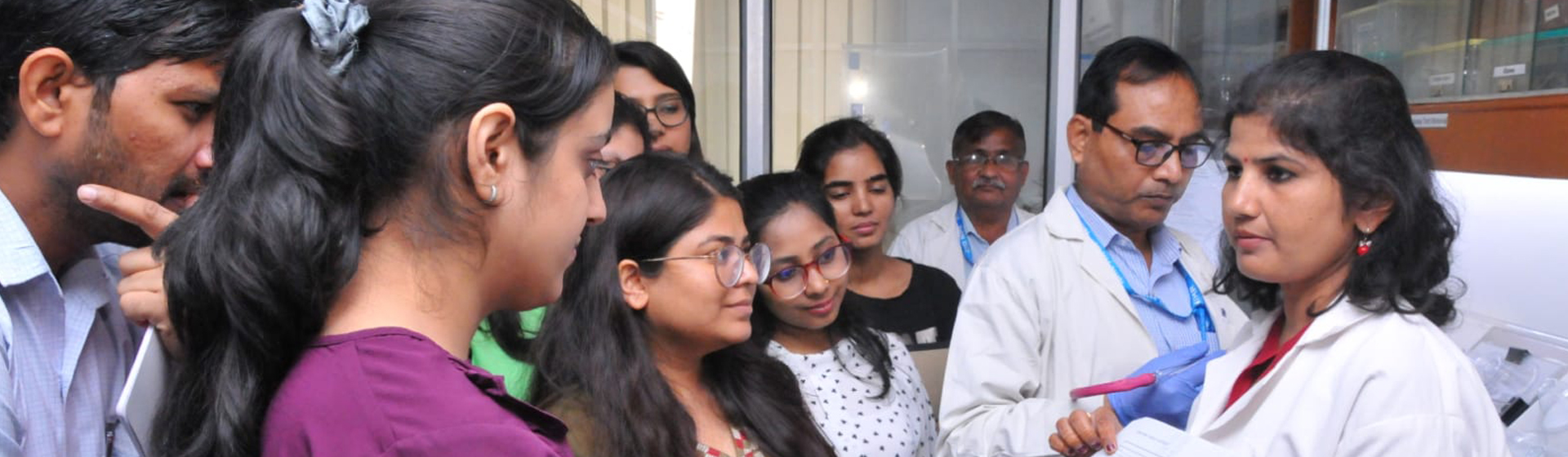 Image of scientist and student discussion